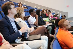 Student listen to a panel