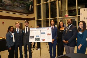 Students presenting the poster "Growing a Skilled Workforce" at Daniel Community Scholars