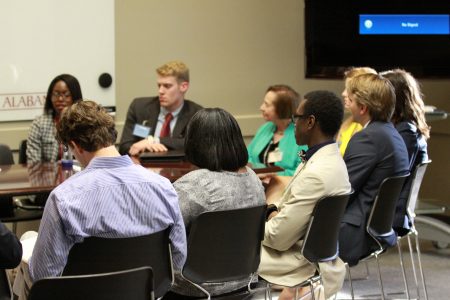 Students, Fellows, and Advisory Board members engaged in a community conversation