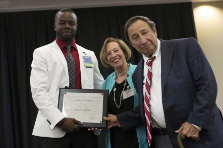 Ibukun Afon (Blackburn Student) receives the 2016 Don and Barbara "Bobbie" Siegal Scholarship from Bobbie Siegal (Advisory Board and Blackburn Society) and Don Siegal (Blackburn Society)